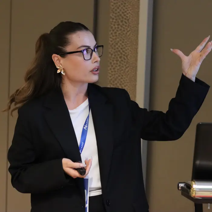 A presenter delivering a talk at a past Acavent conference